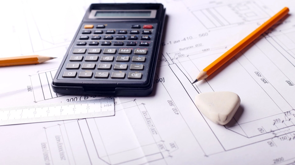 Building plan and a calculator.