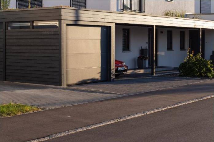 Modern garage carport attached to a building.