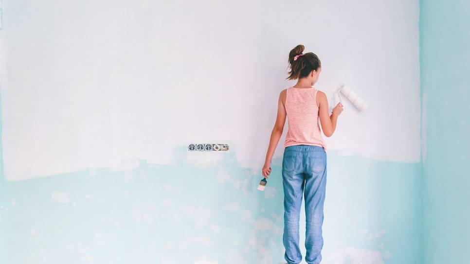 A child painting room light blue