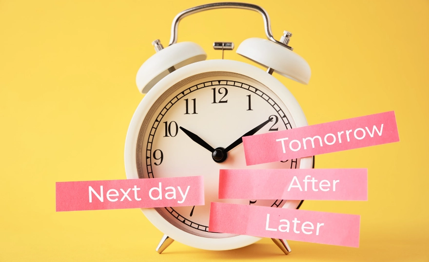 Analogue alarm clock with the words "Tomorrow", "Next day", "Later" besides it.