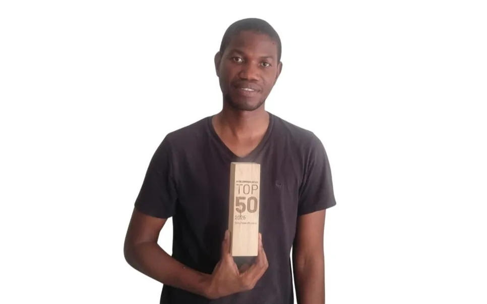 The owner of Delta Power Electronics holding the Procompare.co.za TOP 50 award for 2025, recognizing the business as one of South Africa's top 50 service providers.